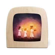 Toverlux lamp, featuring a printed illustration of three children in white robes holding candles against a glowing purple and orange background.