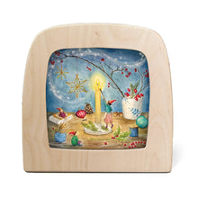 Toverlux lamp featuring a colorful Christmas illustration of a child by a candle, hanging ornaments, and a starry night sky.