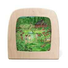 Silhouette of children playing in the water on a summer day with a red cottage in the background