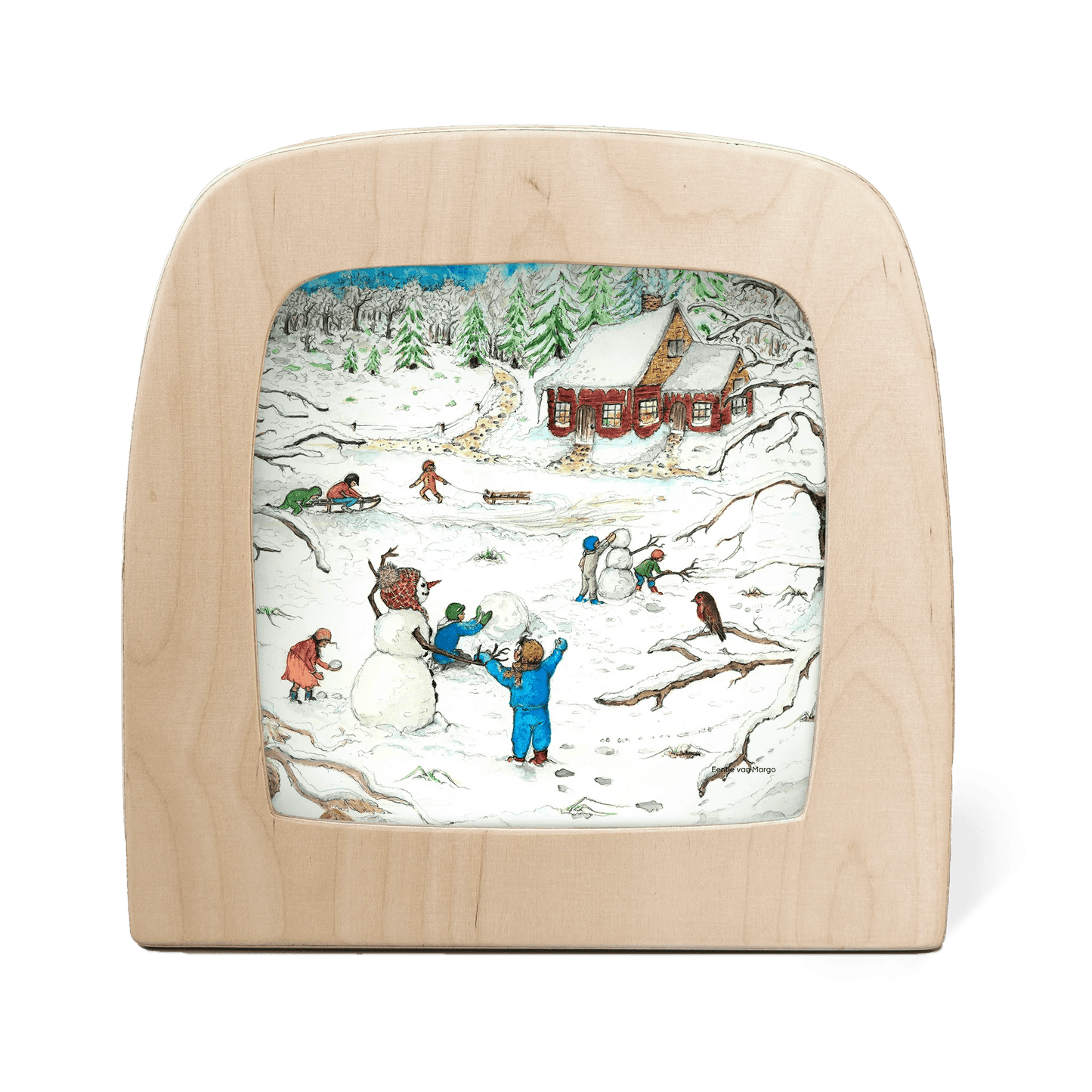 Silhouette of children playing in the snow with a red cottage in the background
