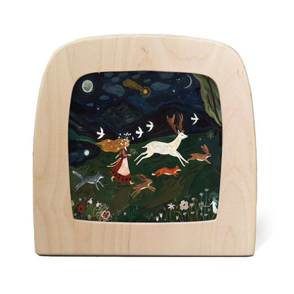 Silhouette of a girl running through a meadow at night surrounded by animals