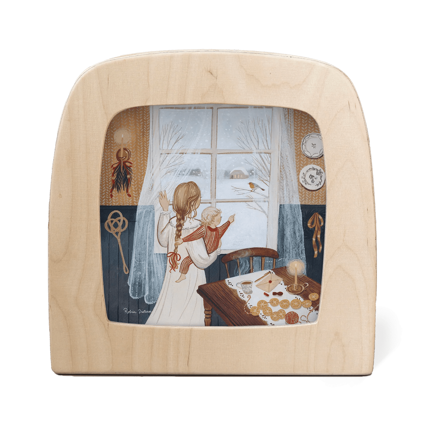 Wooden frame with a scene of two children by a window looking at a robin on a branch.