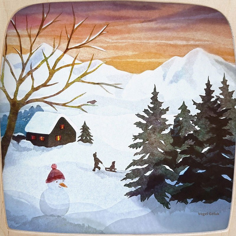 Winter scene with a house, trees, snowman, and children sledding on a snowy landscape.