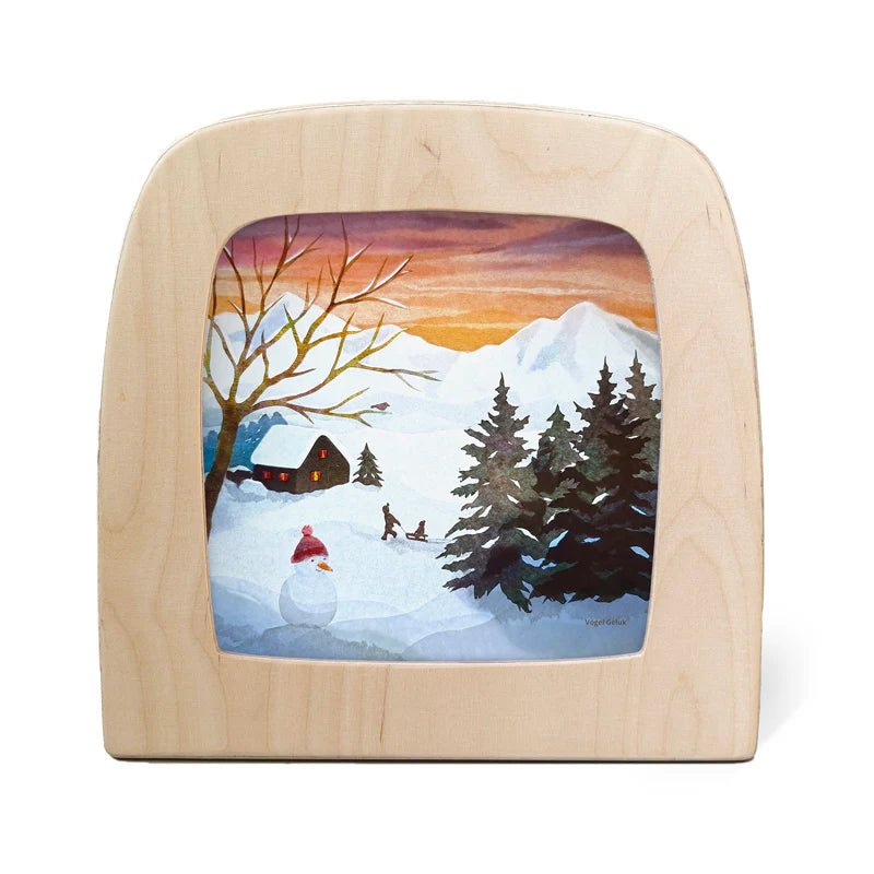 Silhouette of a winter scene with two children sledding