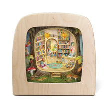 Toverlux lamp featuring the image of a secret library in the hollow of a tree