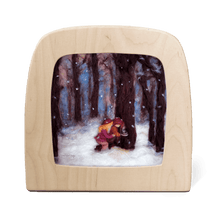 Silhouette of two children in a snowy forest scene