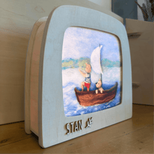 Toverlux lamp customized with the name Stan, silhouette of boy and dog in a sailboat