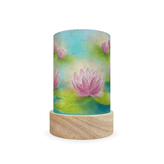 Decorative cylindrical lamp featuring a scene of water lilies in a pond on a white background