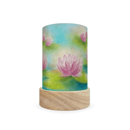 Decorative cylindrical lamp featuring a scene of water lilies in a pond on a white background