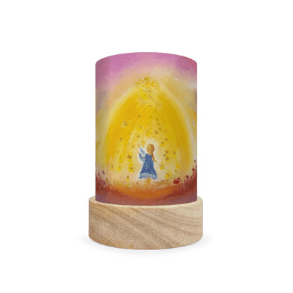 Decorative lamp depicting a scene from Mother Holle on a white background