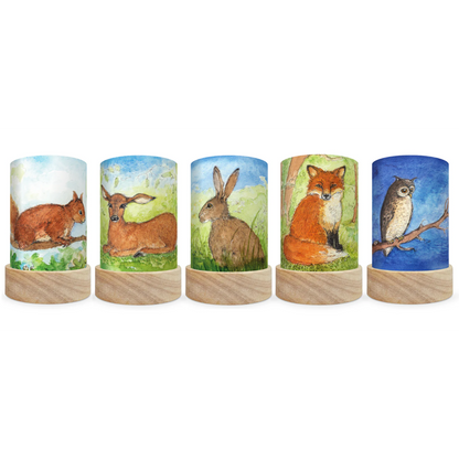 Five mini lantern silhouettes with a squirrel, deer, rabbit, fox, and owl.