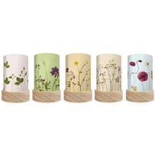 Five mini lanterns with silhouettes of pressed flowers