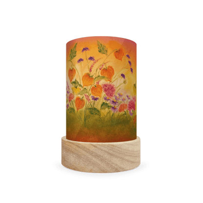 Decorative cylindrical lamp with autumnal orange and pink floral design on a white background