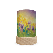 Decorative cylindrical lamp featuring blue and purple spring floral design on a white background