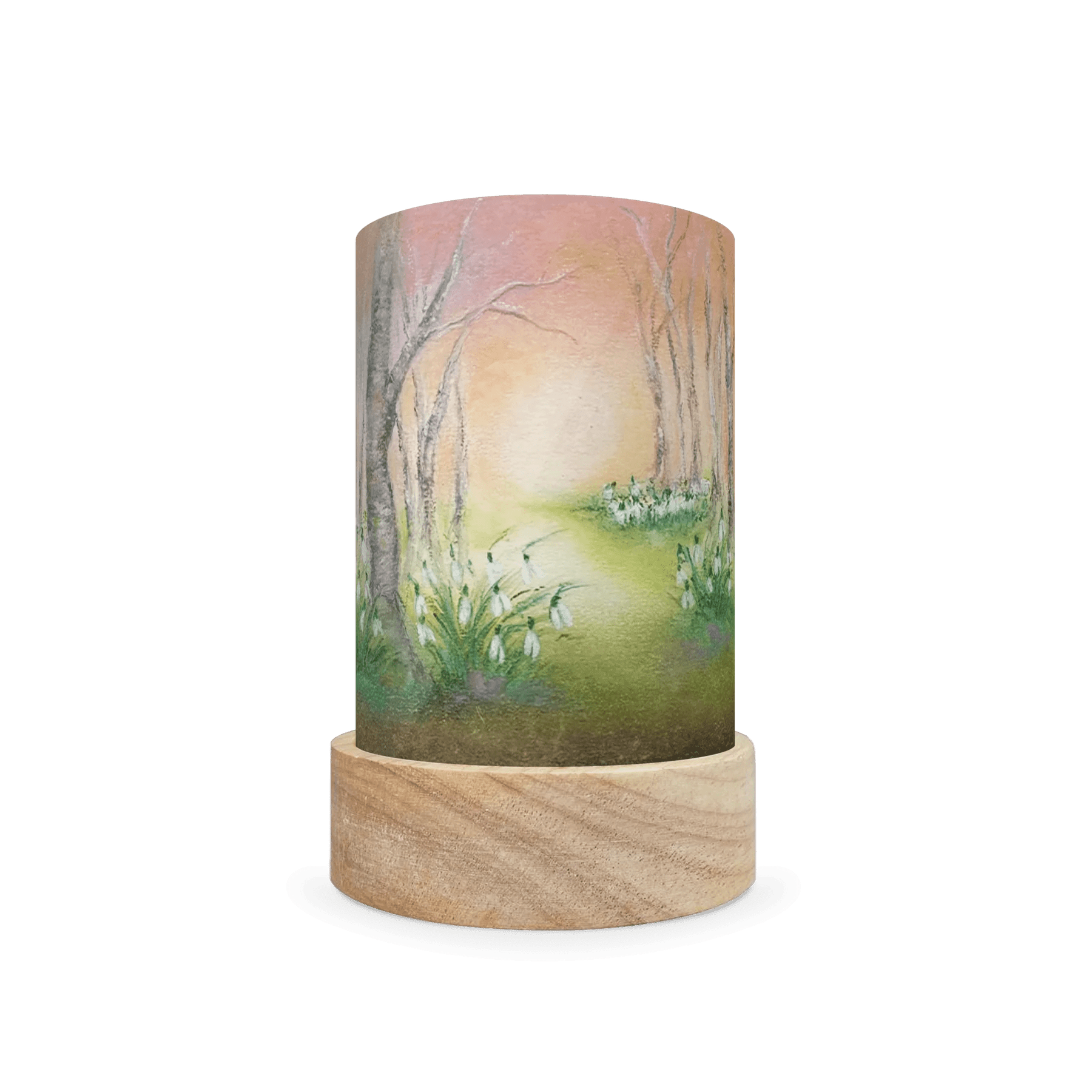 Decorative cylindrical lamp with wintery white flowers and leafless trees on a white background