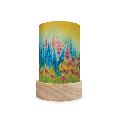 Decorative cylindrical lamp with summery blue and pink floral design on a white background