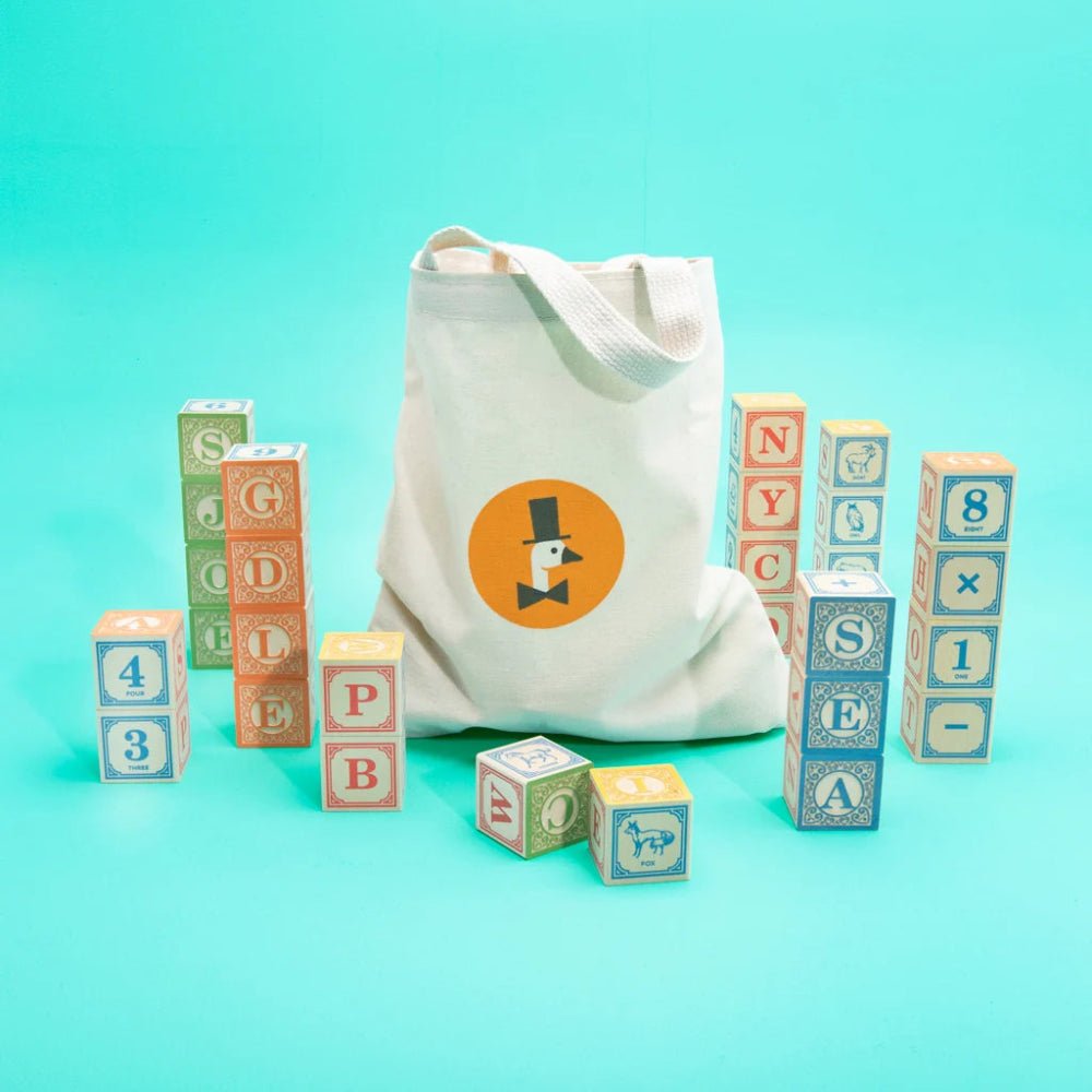 Canvas bag with a logo of a goosewearing a tophat and tie, surrounded by colorful alphabet blocks