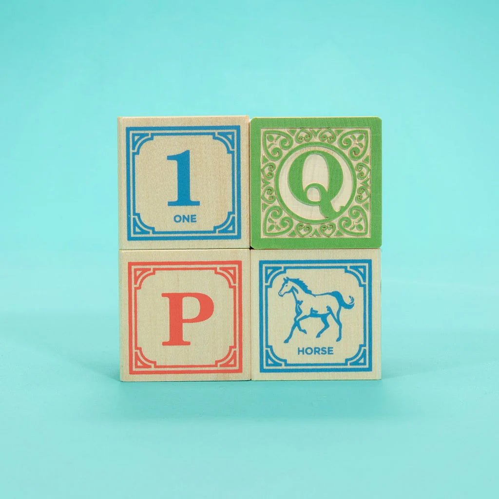 four differently colored blocks with a blue 1, green Q, red P and blue horse on a teal background