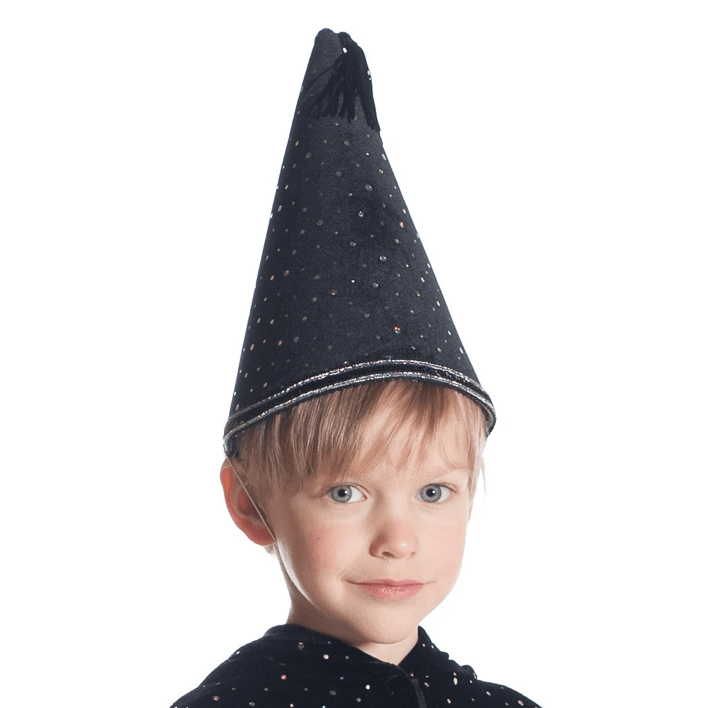 Child wearing a black pointed wizard hat with sparkles on a white background