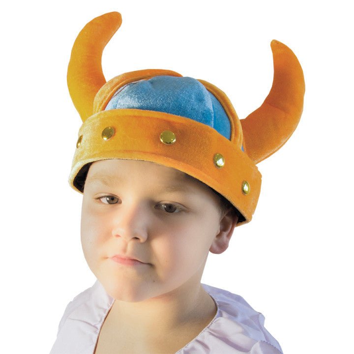 Child wearing a Viking helmet with horns on a white background
