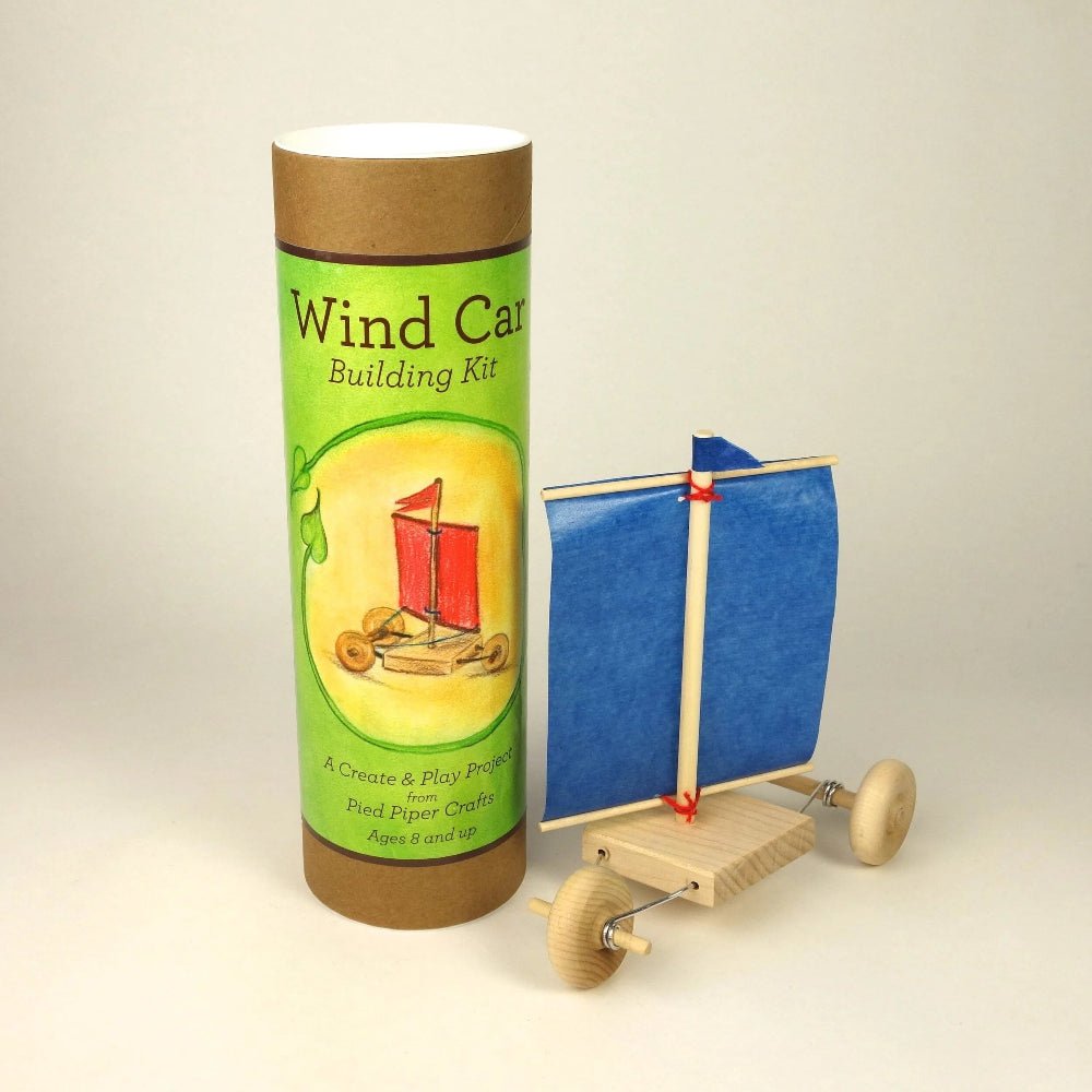 Wind car building kit with packaging on a beige background