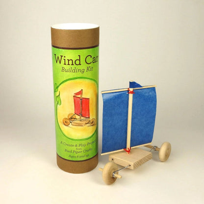 Wind car building kit with packaging on a beige background