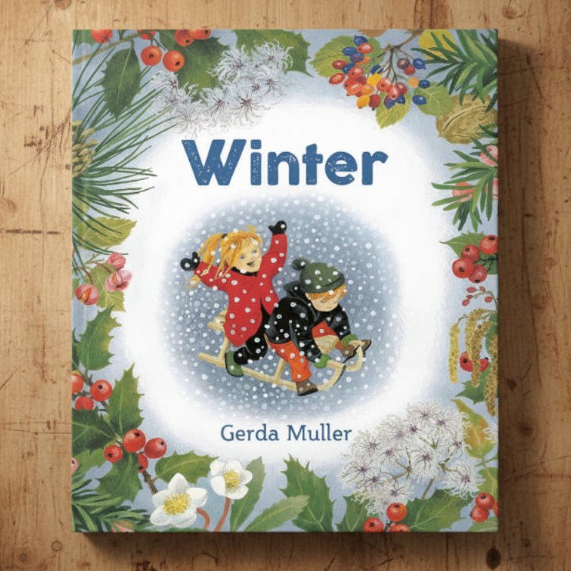 Winter board book by Gerda Muller on a wooden surface