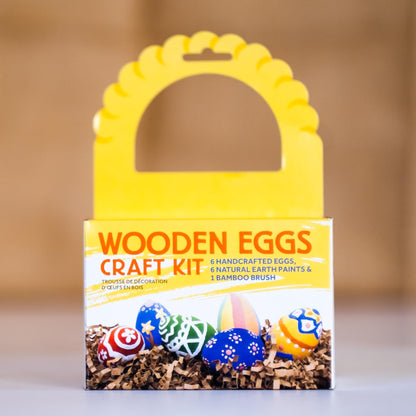 Wooden eggs craft kit packaging with colorful eggs on a neutral background