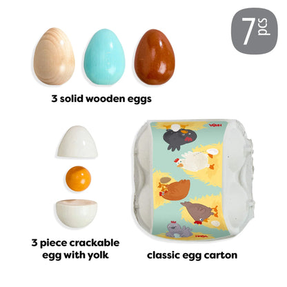 Set of wooden eggs and a crackable egg with yolk, including packaging, on a white background.