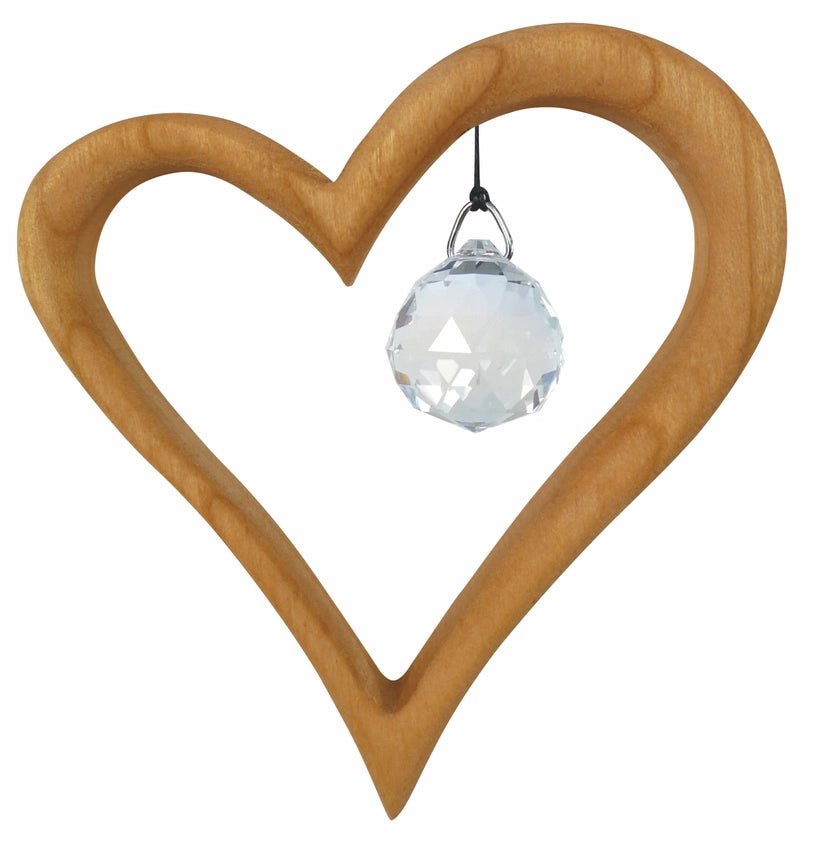 Wooden heart-shaped suncatcher with a clear crystal ball on a white background