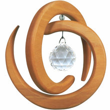 Wooden spiral suncatcher with a crystal ball on a white background