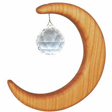 Wooden crescent moon suncatcher with a crystal ball on a white background