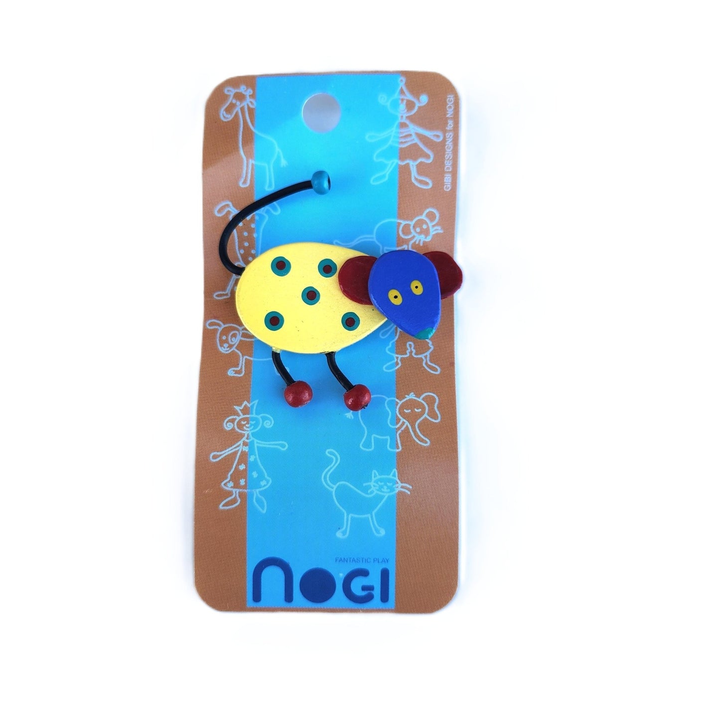 Wooden pin of yellow mouse with red ears and a blue face on Nogi branded packaging