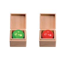 Two wooden boxes with green and red balls inside on a white background