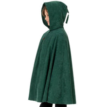 Child wearing a green hooded cape on a white background