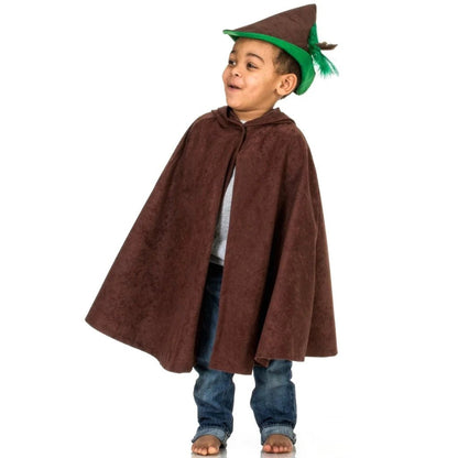 Child wearing a brown cape and brown and green hat on a white background